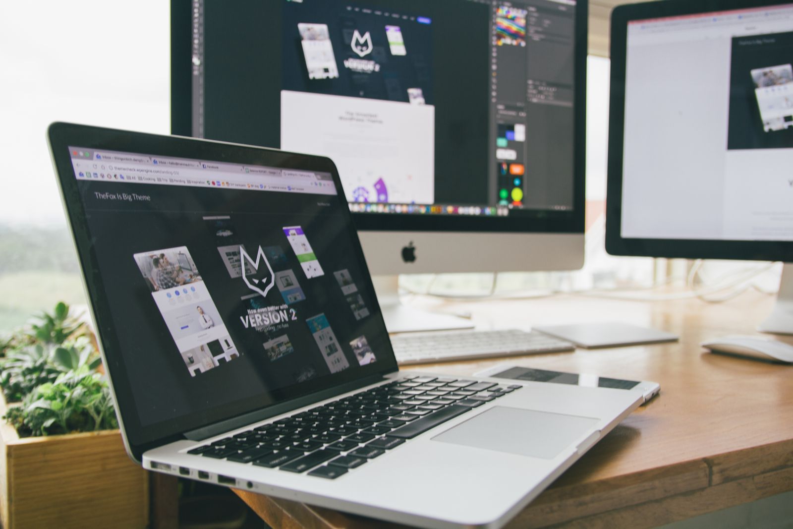 Design workspace with a website build in progress across screens